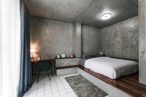 Postel nebo postele na pokoji v ubytování ฟาร์มดั๊กรีสอร์ท Farm Duck Resort