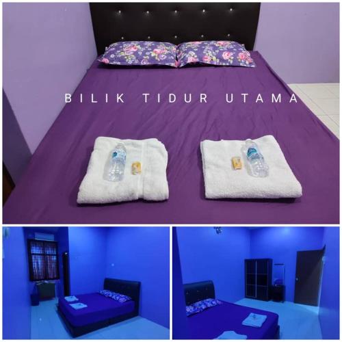 a purple room with a bed with towels and a couch at Zara's Homestay in Kuala Kurau