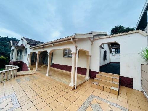 a house with a porch and a patio at 692 Annet Drive in Durban