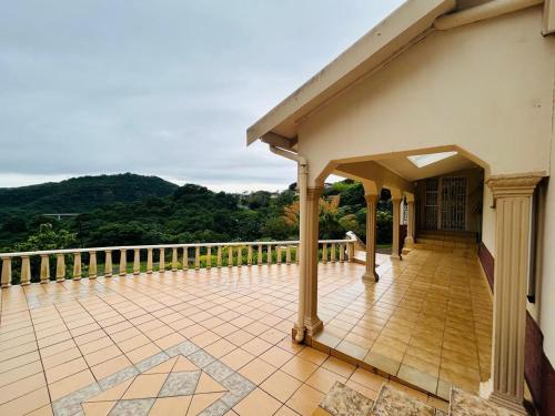 a balcony with a view of the mountains at 692 Annet Drive in Durban