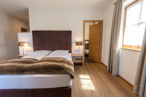 Cama o camas de una habitación en Der Unterwirt Guesthouse and Restaurant