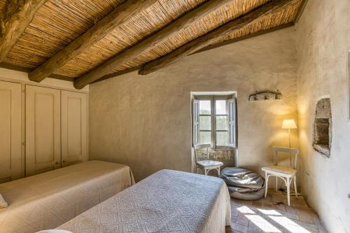 En eller flere senge i et værelse på Villa con encanto Jardín, Wifi y Ac