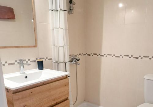 a bathroom with a sink and a shower at Viktoria Houses Anarita in Anarita