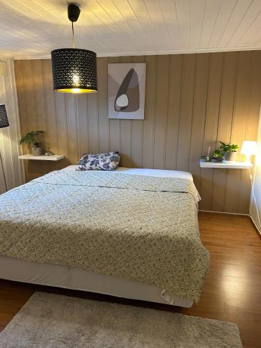 a bedroom with a large bed in a room at Basement Apartment -Ås Ski in Ås