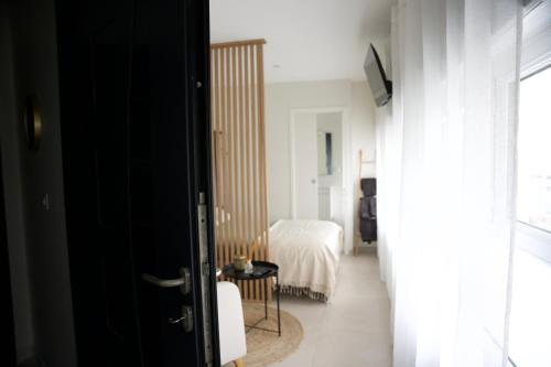 Χώρος καθιστικού στο Studio cosy à 2 pas de l'Espace Carat
