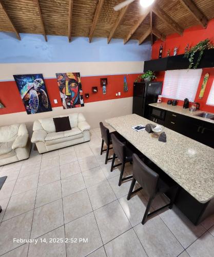a room with a table and chairs and a couch at Carolina Point Resort in Crown Point