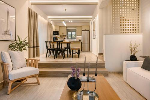 a living room with a couch and a table at Anax by Vintage Travel in Ayia Evfimia