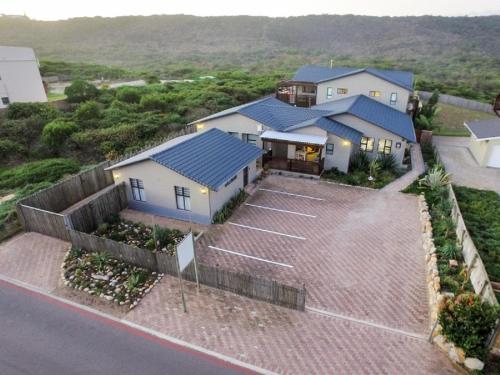 an aerial view of a house with a parking lot at Kamma Kai Beach Villa in Sedgefield