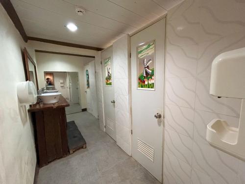 a bathroom with a sink and a toilet at Curv Hotels minutes to Airport- Malls in Puerto Princesa City