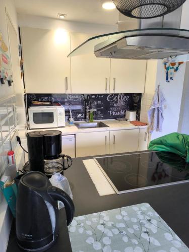 a kitchen with a counter top with a coffee maker at Liège centre 6 rue montagne sainte Walburge, 4000 Liège, pour 2 pers à 3 minutes de la gare st Lambert in Liège