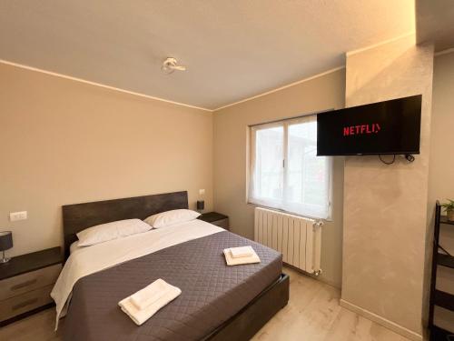 Ένα ή περισσότερα κρεβάτια σε δωμάτιο στο Chorus Apartment