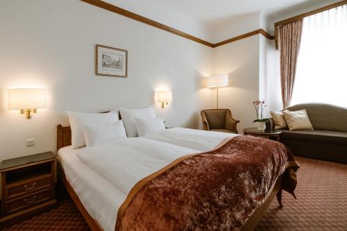 Postel nebo postele na pokoji v ubytování Hotel City Central
