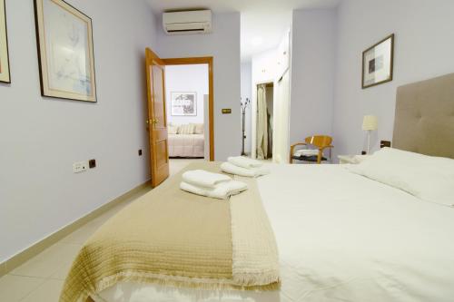 Posteľ alebo postele v izbe v ubytovaní Apartamento Malagueta Gutenberg