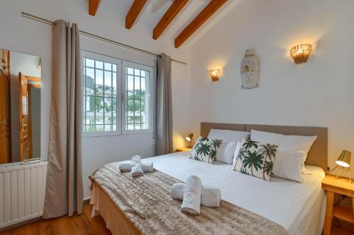 Ένα ή περισσότερα κρεβάτια σε δωμάτιο στο Villa Monteluz Pego