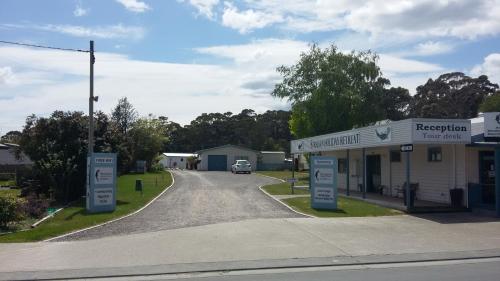 a gas station on a street in a small town at Strahan Retreat Holiday Park in Strahan