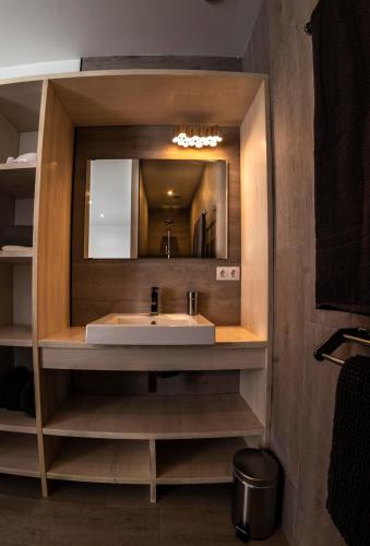 a bathroom with a sink and a mirror at CASA FATIMA Villa with heated pool and jacuzzi in Lajares