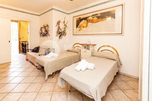 En eller flere senge i et værelse på Conchiglia d'Oro
