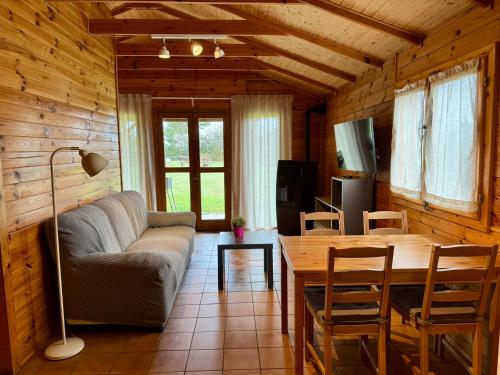 a living room with a couch and a table at Racons del Pedraforca in Saldés