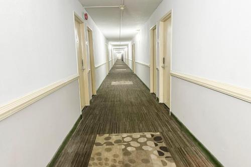 an empty corridor of an office with a long hallway at Jackson Hotel And Convention Center in Jackson