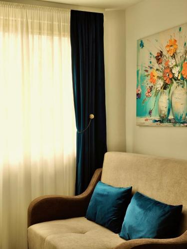 a living room with a couch and a window at Casa SOFI Nr 1, Breaza PH in Breaza