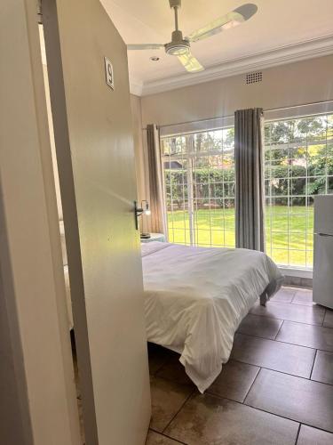 Katil atau katil-katil dalam bilik di WOODS GUEST HOUSE
