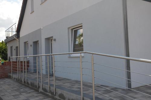 a balcony of a white building with a window at Schlafort in Porta Westfalica