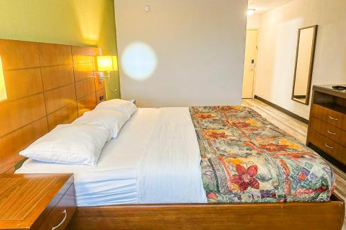 a bedroom with a large bed in a room at Jackson Hotel And Convention Center in Jackson