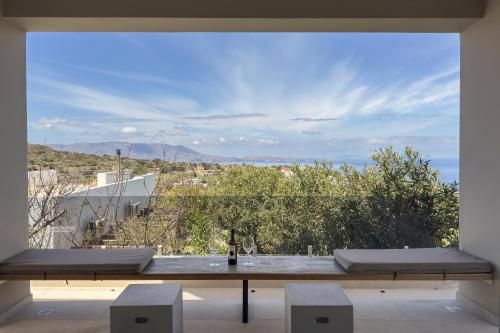 a room with a table and a view of a city at YaChara Villa in Kissamos