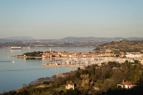 a large body of water with a town and a harbor at Villa Yadranka with Sea view in Strunjan