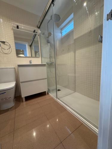 a bathroom with a shower and a sink at Premium Luxury Residence RITS in Salou