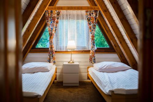 Posteľ alebo postele v izbe v ubytovaní POŁONINY Resort