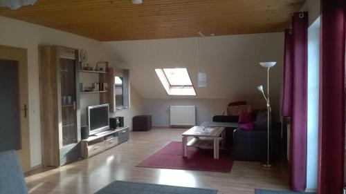 Телевизор и/или развлекательный центр в Ferienwohnung beim Ried