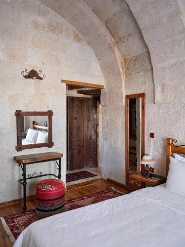 Una cama o camas en una habitación de Kelebek Special Cave Hotel & Spa