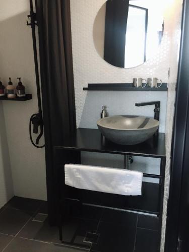 a bathroom with a sink and a mirror at Just Inn Xin Yi 正旅館 信義 in Taipei