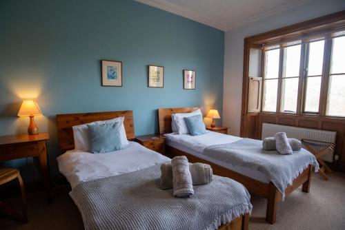 Ένα ή περισσότερα κρεβάτια σε δωμάτιο στο Brantwood Lodge