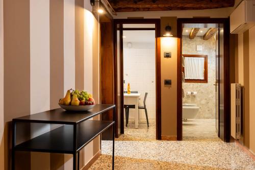 a bathroom with a bowl of fruit on a table at Ca' San Geremia in Venice