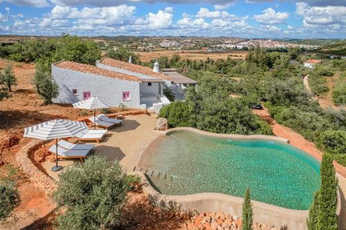 an aerial view of a house with a swimming pool at Casa da Encosta in Silves