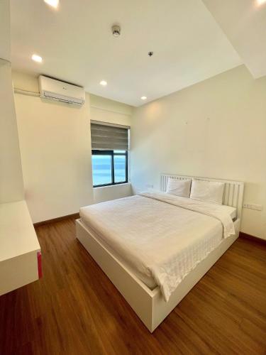 Katil atau katil-katil dalam bilik di FLC Sea Tower Quy Nhơn - Căn hộ view biển