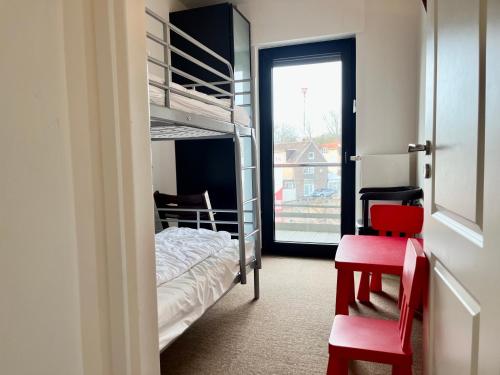 Ένα ή περισσότερα κρεβάτια σε δωμάτιο στο Appartementhaus Seemöwe Silbermöwe