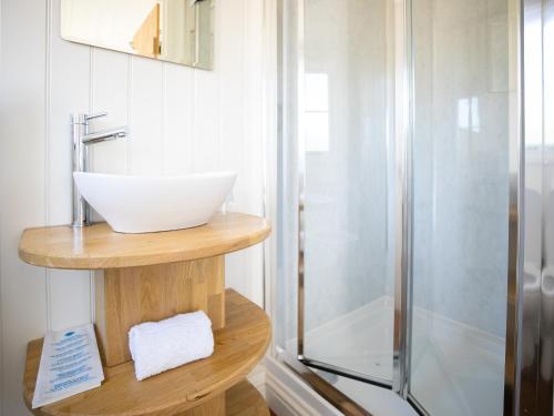 a bathroom with a sink and a shower at Strathmore in Forfar