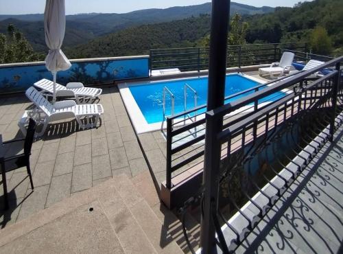 a balcony with a view of a swimming pool at Holiday Home Martin in Varaždinske Toplice