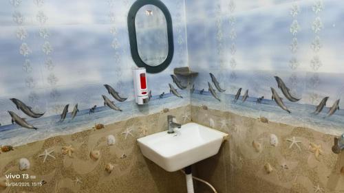 a bathroom with a sink and a mirror at Hotel Shanti Niketan By Nexottel in Deoghar