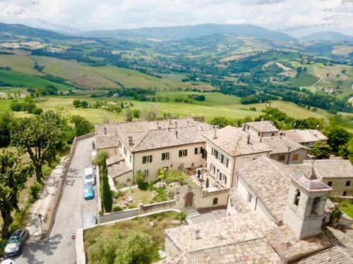 an aerial view of a village with houses at Palazzo Minzoni in SantʼIppolito