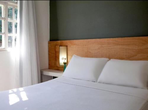 Katil atau katil-katil dalam bilik di Sonhos ML ApartHotel