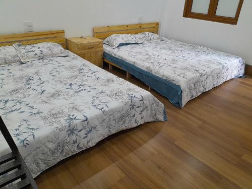 Katil atau katil-katil dalam bilik di Phieu Homestay