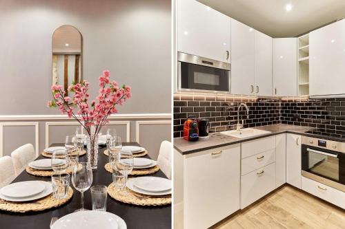 une cuisine avec une table avec des assiettes et des verres à vin dans l'établissement Apartment Opéra by Studio prestige, à Paris