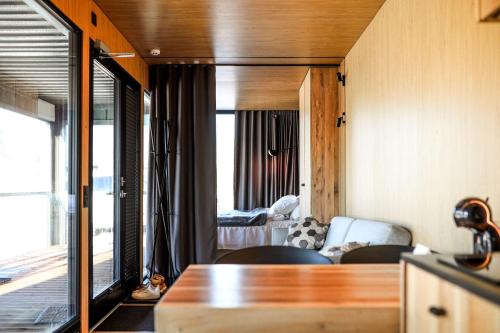 a living room with a view of a bedroom at Rummu Holiday Home in Rummu