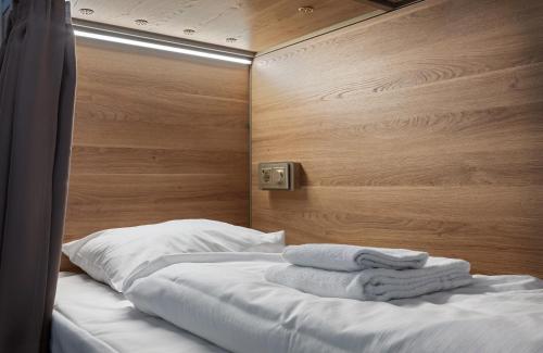 Uma cama ou camas num quarto em K7 Hotel Oslo