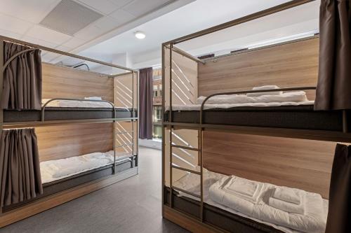 Uma cama ou camas num quarto em K7 Hotel Oslo