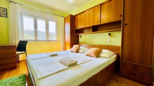 Postel nebo postele na pokoji v ubytování Apartments - Villa Sidro